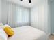 Inviting bedroom with a soft bed, bright window, and closet adding a cozy yet functional space at 11960 De Leon Dr, North Port, FL 34287