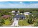 Beautiful exterior view of a modern home with a well-manicured lawn and a paved driveway at 11960 De Leon Dr, North Port, FL 34287