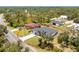 Exterior of a modern home with a spacious, well-maintained lawn and a paved driveway at 11960 De Leon Dr, North Port, FL 34287