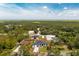 Aerial view of the home showcasing its location amidst lush greenery and neighboring homes at 11960 De Leon Dr, North Port, FL 34287