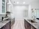 Modern kitchen featuring granite countertops, stainless steel appliances, and a stainless steel range hood at 11960 De Leon Dr, North Port, FL 34287