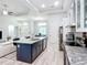 Bright kitchen with granite countertops, stainless steel appliances, and a large island at 11960 De Leon Dr, North Port, FL 34287