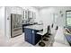 Gourmet kitchen featuring an eat-in island, stainless steel appliances, and granite countertops at 11960 De Leon Dr, North Port, FL 34287