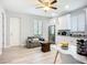 Bright kitchen with white cabinets, stainless steel appliances, and adjacent seating area at 11960 De Leon Dr, North Port, FL 34287