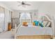 Charming bedroom with neutral tones, abundant natural light, and serene ambiance at 12230 Amica Loop, Venice, FL 34293