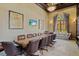 Spacious conference room with a large table, leather chairs, and elegant chandelier at 12230 Amica Loop, Venice, FL 34293