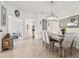 Dining room with elegant decor and access to other rooms in the home at 12230 Amica Loop, Venice, FL 34293
