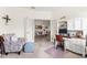 Home office with a built-in desk and French doors leading to the dining room at 12230 Amica Loop, Venice, FL 34293