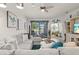 Cozy living room boasts serene water views and stylish coastal-themed decor at 12230 Amica Loop, Venice, FL 34293