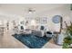 Spacious living room, seamlessly connected to the kitchen and dining area, provides ample seating at 12230 Amica Loop, Venice, FL 34293