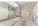 Bathroom with granite countertop, decorated with a beach theme at 13711 Messina Loop # 102, Lakewood Ranch, FL 34211