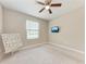 Bedroom with ceiling fan and neutral paint, creating a serene and comfortable living space at 13711 Messina Loop # 102, Lakewood Ranch, FL 34211