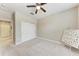 Bedroom with ceiling fan and double closet, offering practical storage solutions at 13711 Messina Loop # 102, Lakewood Ranch, FL 34211