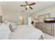 Relaxing main bedroom with adjoining bathroom and lounge area at 13711 Messina Loop # 102, Lakewood Ranch, FL 34211