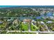 Expansive aerial view of waterfront property with lush landscaping and private canal access at 1475 Bayshore Dr, Englewood, FL 34223
