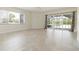 Bright bedroom featuring a sliding glass door to the pool area and neutral tones throughout, creating a calming atmosphere at 1475 Bayshore Dr, Englewood, FL 34223
