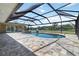 Enjoy spectacular waterfront views from this refreshing screened-in pool and backyard at 1475 Bayshore Dr, Englewood, FL 34223