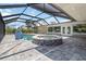 Screened in lanai with a pool, spa and brick pavers at 1475 Bayshore Dr, Englewood, FL 34223