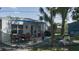 The covered patio has an outdoor dining area, a fire pit, and a shed at 1801 Marilyn Ave, Bradenton, FL 34207