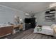 Serene bedroom featuring a desk, modern furniture, and light blue paneled walls at 1801 Marilyn Ave, Bradenton, FL 34207