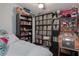 Fun bedroom featuring a comfy bed, ceiling fan, large record collection, and vintage pinball machine at 1801 Marilyn Ave, Bradenton, FL 34207