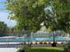 Inviting community swimming pool surrounded by landscaped gardens and mature trees at 1801 Marilyn Ave, Bradenton, FL 34207