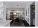 Cozy dining room with modern lighting, stylish decor, and adjacent kitchen access at 1801 Marilyn Ave, Bradenton, FL 34207