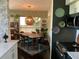 Bright dining room with mid-century modern table, chairs, and a decorative pendant light fixture at 1801 Marilyn Ave, Bradenton, FL 34207