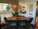 Dining area featuring a large oval table and bright, sunlit windows at 1801 Marilyn Ave, Bradenton, FL 34207