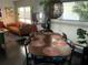 Bright dining room features a unique lighting fixture and natural light, complemented by elegant furnishings at 1801 Marilyn Ave, Bradenton, FL 34207