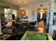 Open dining room with view of the living area and hallway at 1801 Marilyn Ave, Bradenton, FL 34207