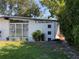 Well-lit single-story home with a modern design, stylish landscaping, and a pristine green lawn at 1801 Marilyn Ave, Bradenton, FL 34207
