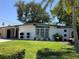 Inviting single-story home featuring a lush green lawn and attractive landscaping at 1801 Marilyn Ave, Bradenton, FL 34207