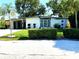 Stylish single-story home with a well-kept lawn, modern accents, and neatly trimmed hedges adding to its curb appeal at 1801 Marilyn Ave, Bradenton, FL 34207
