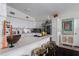 Spacious kitchen featuring white cabinetry, stainless steel appliances, and a breakfast bar at 1801 Marilyn Ave, Bradenton, FL 34207
