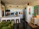 Bright kitchen featuring modern white cabinets, stainless steel appliances, and an eat-in island with barstool seating at 1801 Marilyn Ave, Bradenton, FL 34207