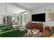 Bright living room with modern furnishings, large windows, and contemporary decor at 1801 Marilyn Ave, Bradenton, FL 34207