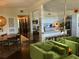 Open-concept living and kitchen area with dark hardwood floors and modern decor at 1801 Marilyn Ave, Bradenton, FL 34207