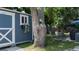 The backyard features a blue shed with a white door and window box at 1801 Marilyn Ave, Bradenton, FL 34207