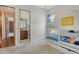 Charming bedroom with a bunk bed and a view of the en suite bathroom and a hallway at 1813 Boyce St, Sarasota, FL 34239