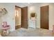 Cozy bedroom featuring plush carpeting, a vanity, and doorway to a hallway with wood floors at 1813 Boyce St, Sarasota, FL 34239