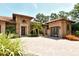 Beautiful exterior view highlighting the stone accents, tile roof, and well-maintained landscaping at 1813 Boyce St, Sarasota, FL 34239