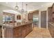 Spacious kitchen featuring a large island, stainless steel appliances, and custom cabinetry at 1813 Boyce St, Sarasota, FL 34239