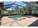 Enclosed backyard pool area with lounge chairs and beautiful landscaping at 1813 Boyce St, Sarasota, FL 34239