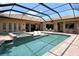Gorgeous backyard pool area featuring tile decking, a built-in spa, and inviting lounge chairs at 1813 Boyce St, Sarasota, FL 34239
