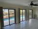 Living room overlooking the pool, with sliding glass doors and tiled flooring at 191 Maria Ct, Punta Gorda, FL 33950