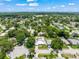 Aerial view of the neighborhood highlighting the lush tree coverage and surrounding area at 1915 38Th W St, Bradenton, FL 34205