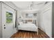 Small bedroom with a bunk bed, closet, and a door to the exterior at 1915 38Th W St, Bradenton, FL 34205
