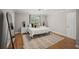 Bright bedroom features modern decor with wooden floors, neutral rug and mirror at 1915 38Th W St, Bradenton, FL 34205