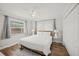 Neutral bedroom with wood floor, ceiling fan, and windows with natural light at 1915 38Th W St, Bradenton, FL 34205